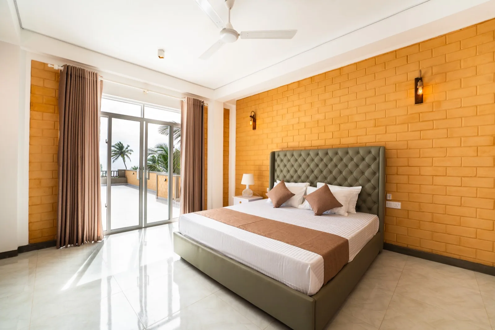 King bed beside the balcony doors in the Double Room with Balcony and Sea View
