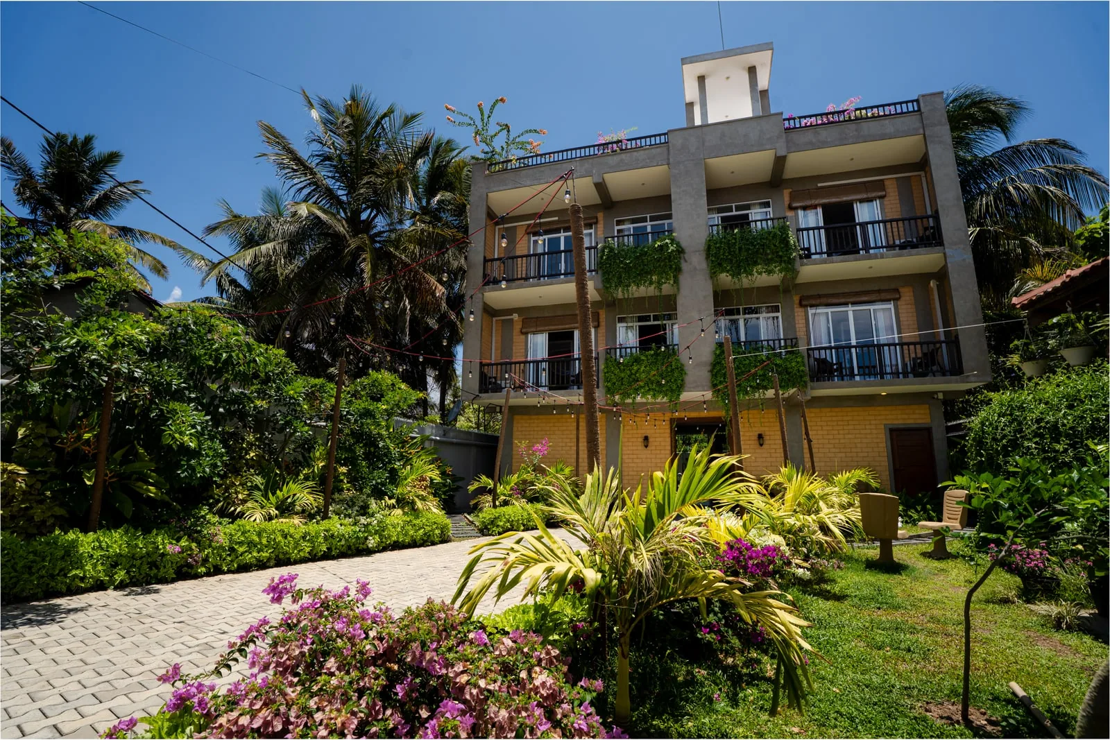 Bliss Blessings Villa & Spa exterior surrounded by tropical gardens in Hikkaduwa